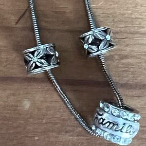 Brighton silver necklace with 3 charms, one reads “ family”, 16-18”, used